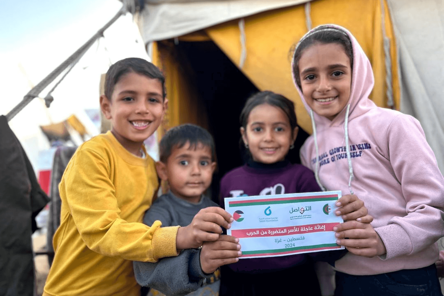 Displaced Palestinian children receiving financial help