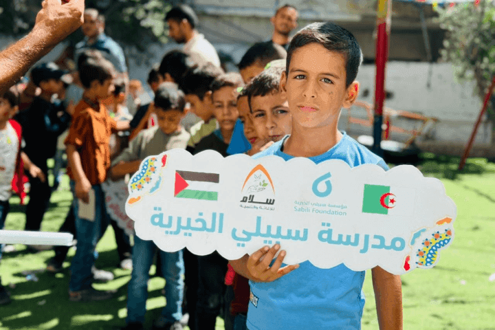 Displaced children in Gaza gather in a schoolyard