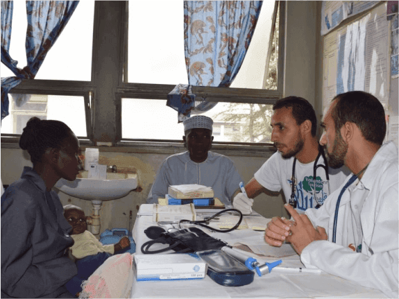 Two doctors from Sabili Foundation receiving a patient and providing consultation