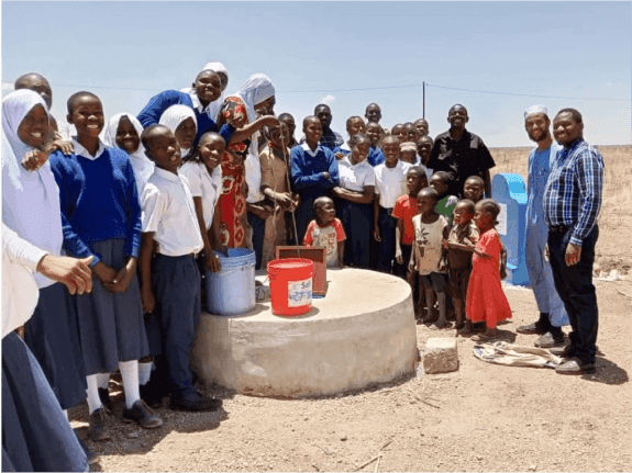 Village community celebrates the opening of a new drinking well